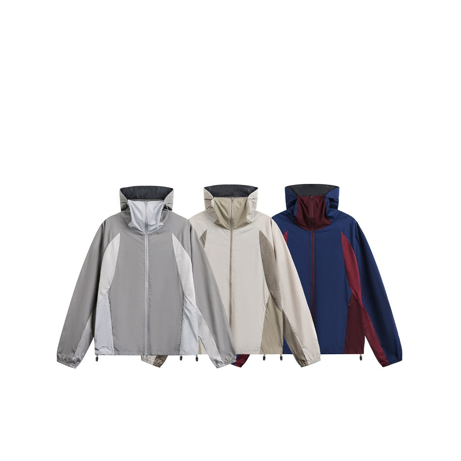 Three front views of the same high-collar zip jacket in gray, light beige, and navy with burgundy panels.