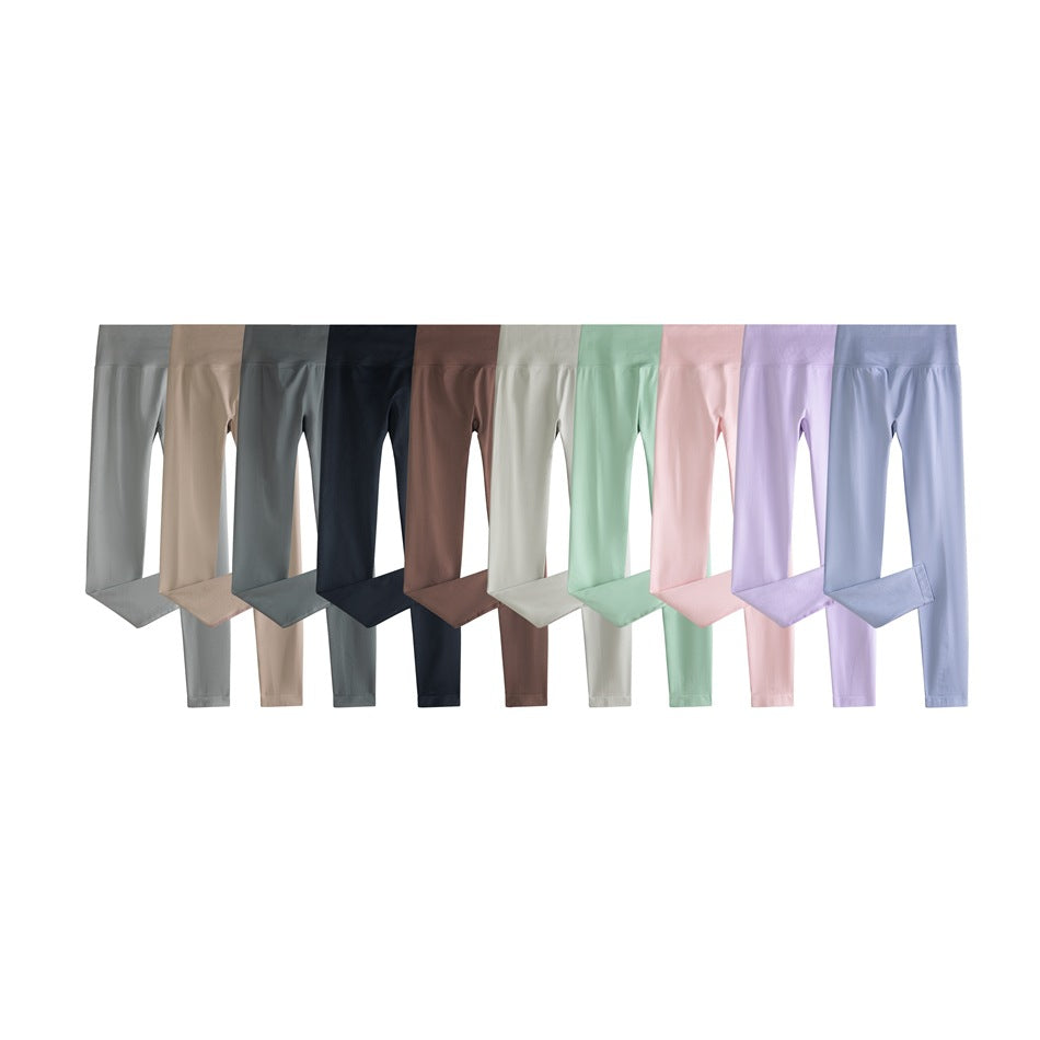 Ten pairs of full-length leggings arranged side by side in neutral, dark, pastel, and light blue colors.