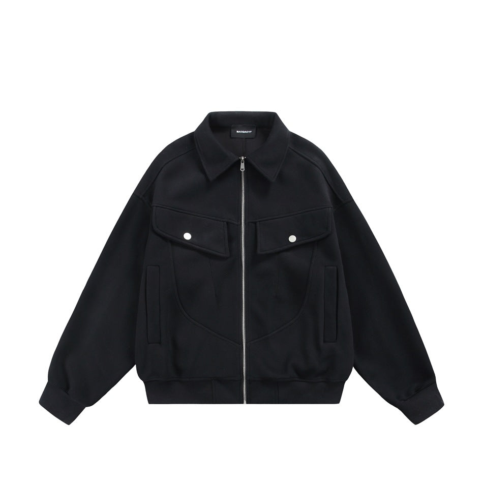 Black zip-front jacket with collar, snap chest flap pockets, side pockets and ribbed hem, flat lay