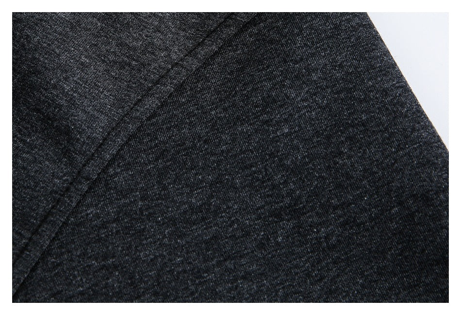 Close-up of charcoal heather fabric and a curved stitched seam.