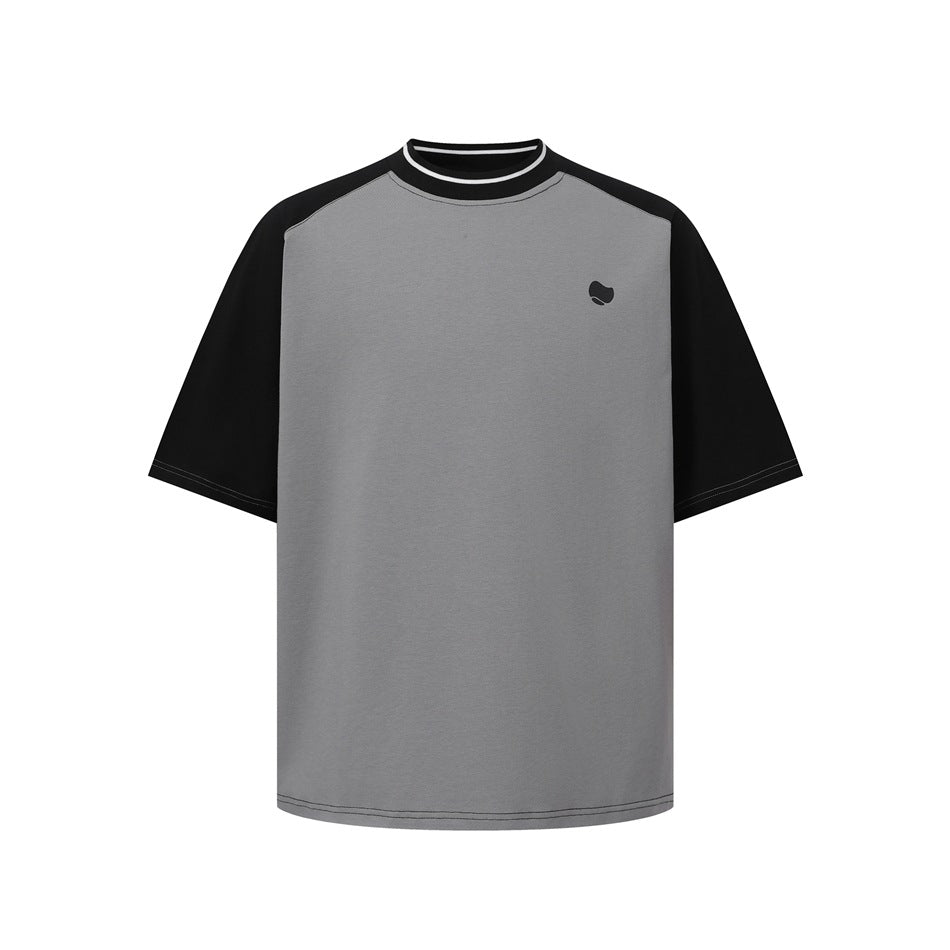 Front view of a gray T-shirt with black raglan sleeves, a striped collar and a small chest emblem.