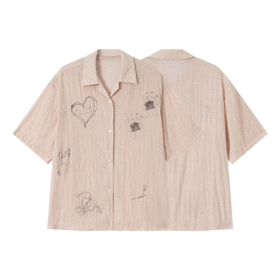 Pale blush short-sleeve button-front shirt shown from front and back, with a pointed collar, black dots, and sketch-style