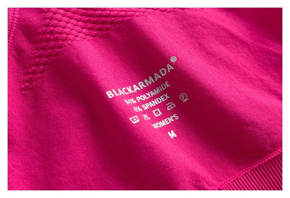 Magenta garment detail with printed label: Blackarmada, 94% polyamide, 6% spandex, women's size M.