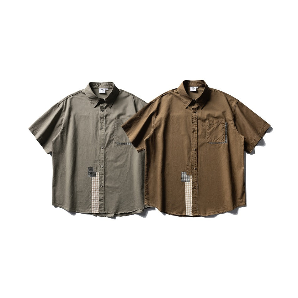 Two short-sleeve button-up shirts shown flat, one gray and one brown, with plaid accents and chest pockets.