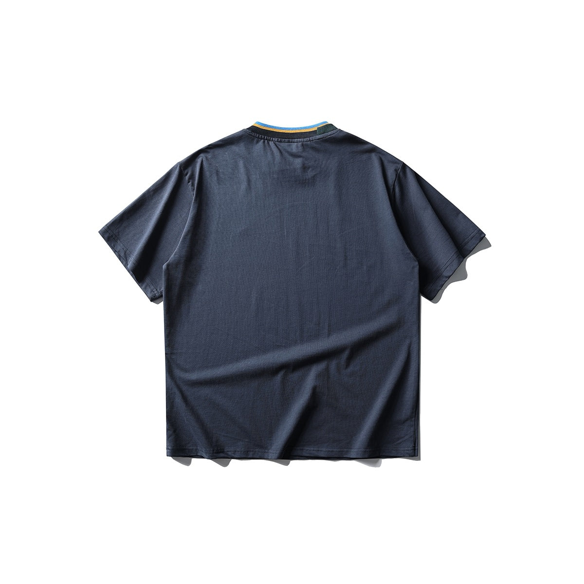 Back view of navy short-sleeve T-shirt with blue and yellow striped ribbed collar, flat lay