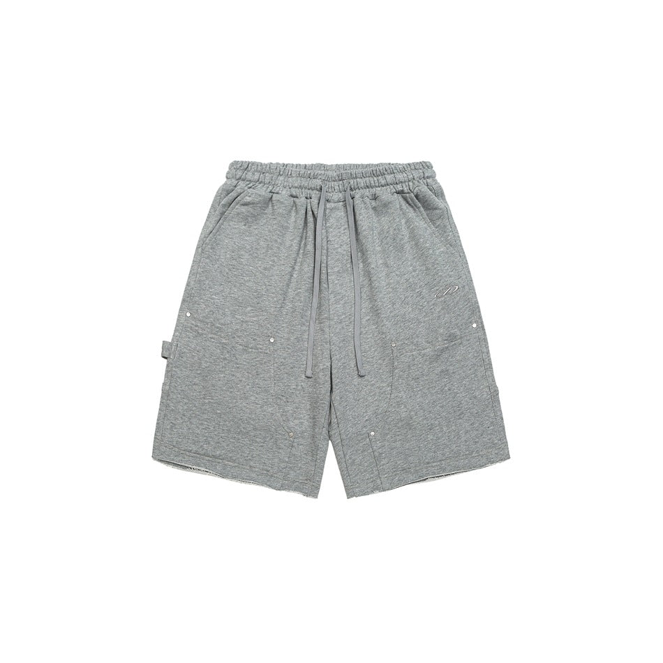 Heather gray drawstring knee-length shorts with front patch pockets, metal rivets and raw hems, front view