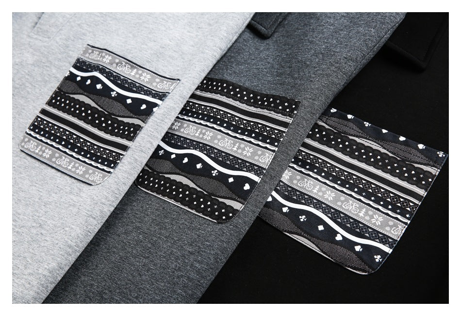 Close-up of patterned patch pockets on light gray, charcoal, and black shirts; each patch has black, white, and gray bands.