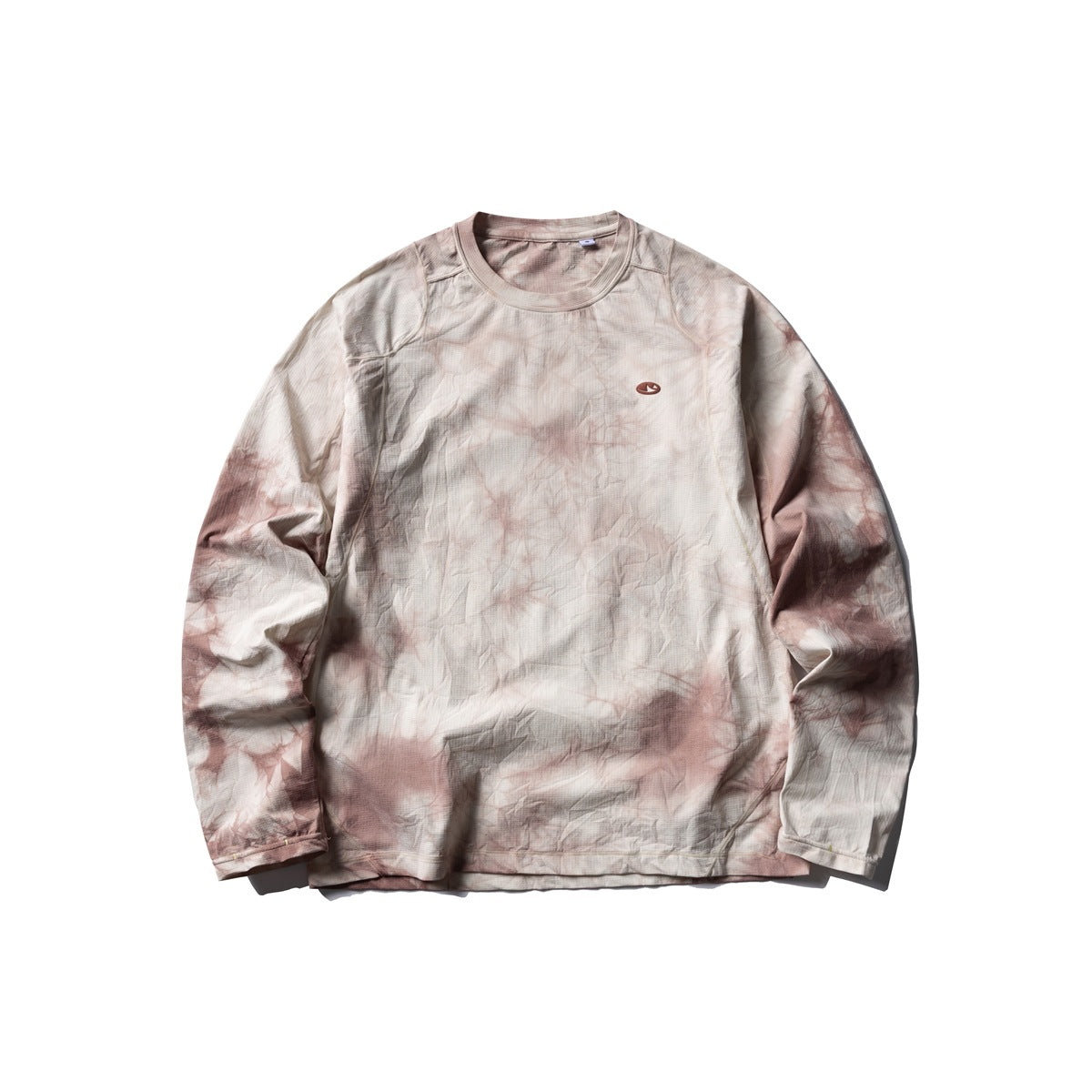 Pink tie-dye long-sleeve crew-neck top flat lay on a white background, with a small oval chest patch