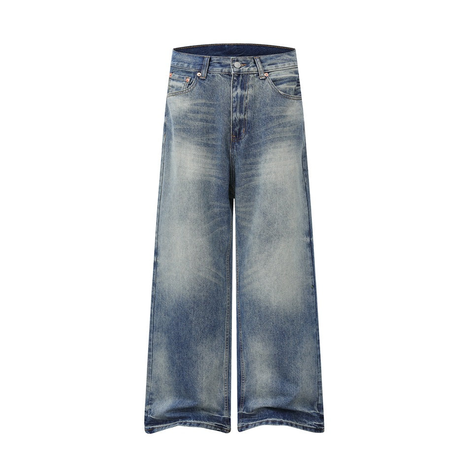 Front of faded blue washed wide-leg jeans with whiskering, belt loops, button and zip fly on a white background