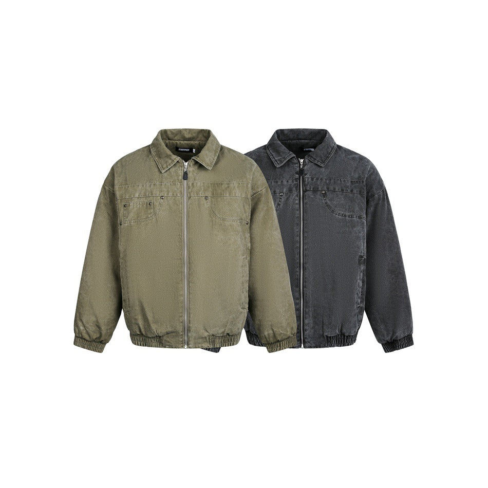 Two zip-front jackets with pointed collars and chest pockets, shown in olive and charcoal.