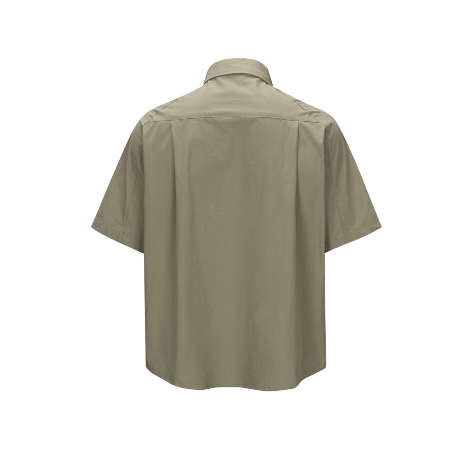 Olive green short-sleeve shirt, back view with shoulder yoke and center pleat