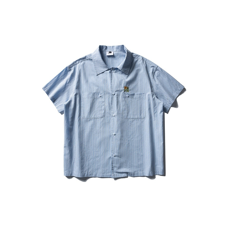 Blue striped short-sleeve button-up shirt with two chest pockets and a small embroidered sunflower, flat lay