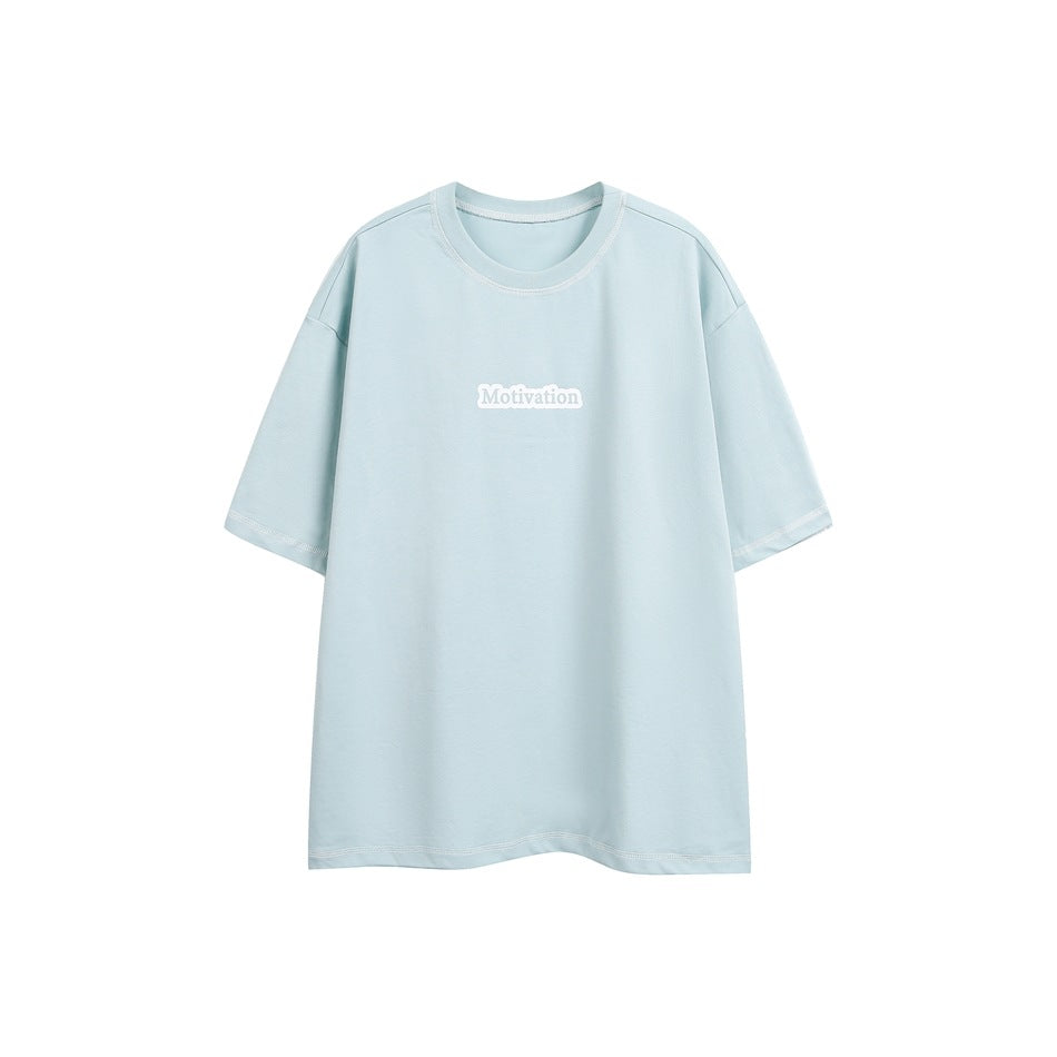 Light blue short-sleeve t-shirt with white contrast stitching and a small Motivation graphic on the chest
