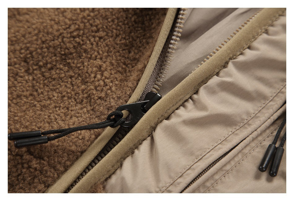 Close-up of the jacket's front zipper, cord pulls, brown fleece, and beige lining.