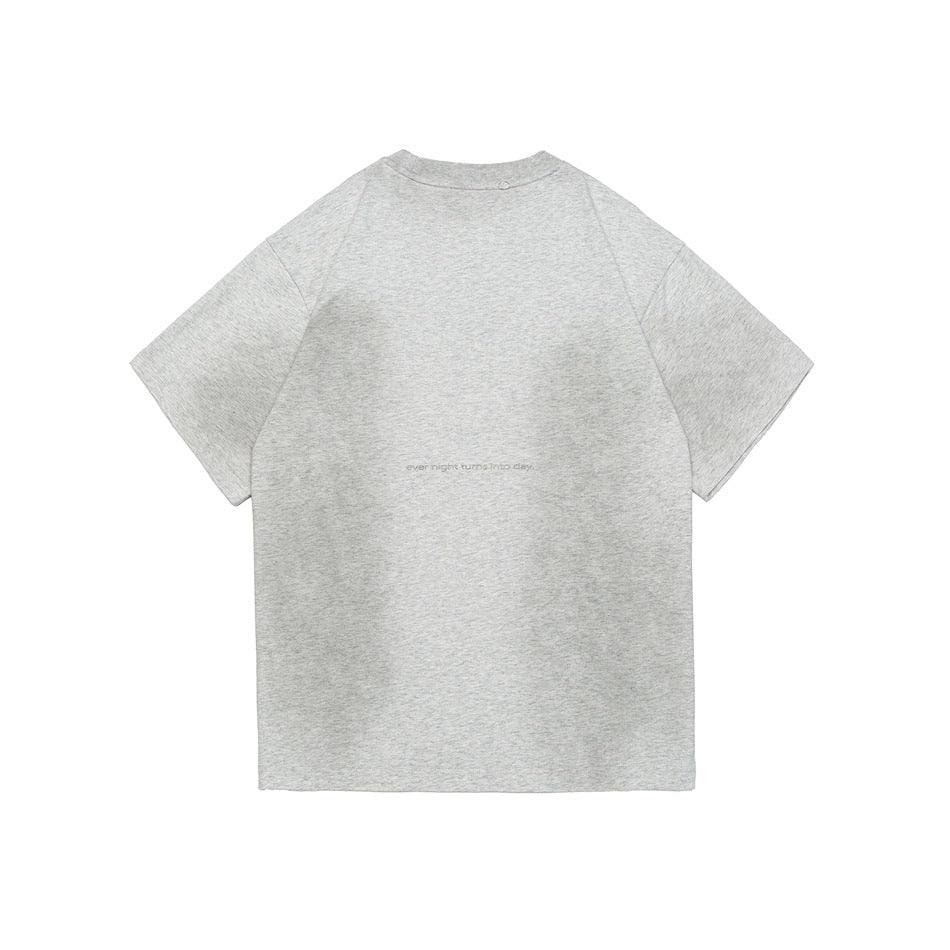 Back view of a heather gray short-sleeve crew-neck T-shirt with faded wash patches and a small line of text at mid-back