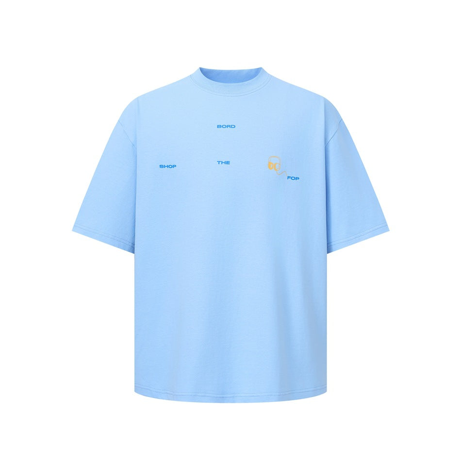 Light blue short-sleeve crew-neck T-shirt with small blue chest text and a yellow headphone graphic, flat front view