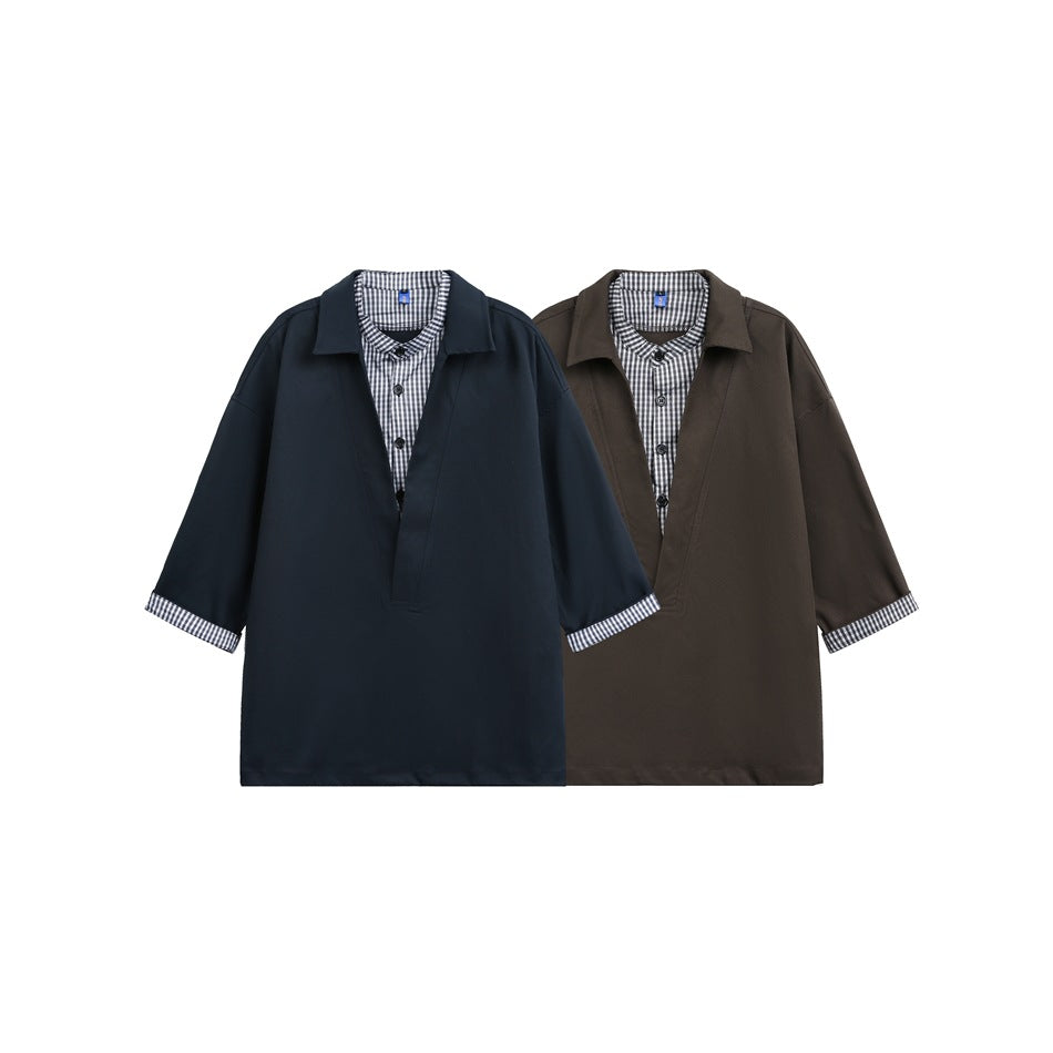 Front view of navy and dark brown collared shirts with checked inner plackets and turned-back checked cuffs.