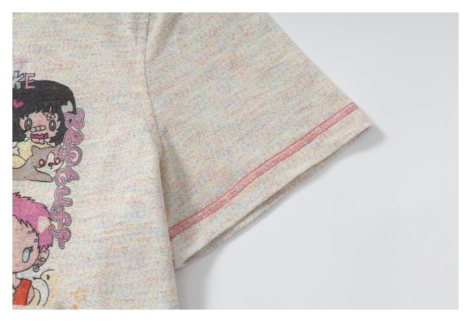 Close-up of a short sleeve on a pastel-speckled T-shirt, showing pink contrast stitching at the cuff.