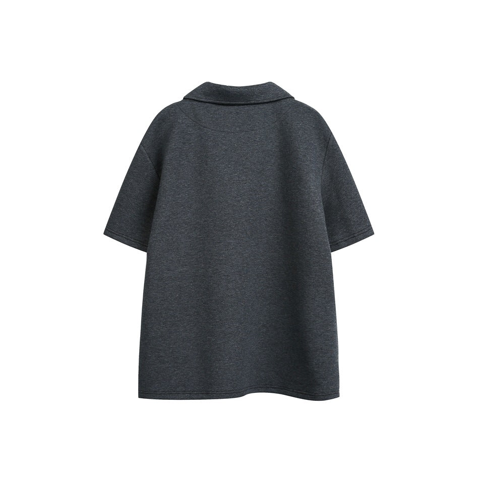 Back view of a dark charcoal short-sleeve polo.