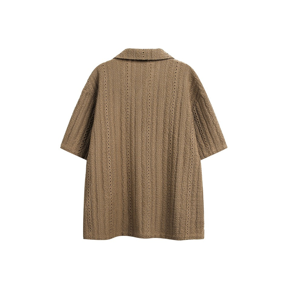 Back view of a tan-brown short-sleeve button-up shirt with a wide collar and vertical openwork stripes.