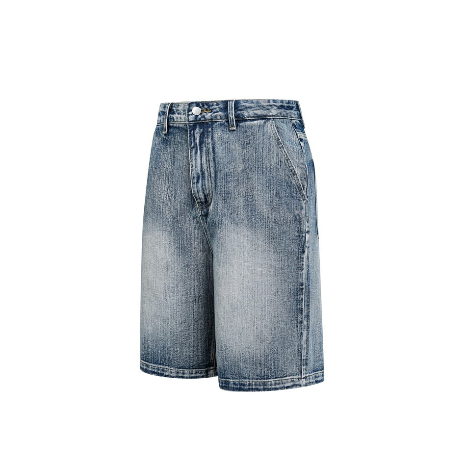 Washed blue knee-length denim shorts shown at a three-quarter angle on a plain white background