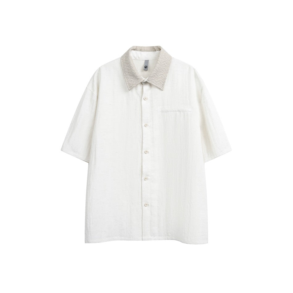 Off-white short-sleeve button-up shirt with beige textured collar and chest pocket, flat front view