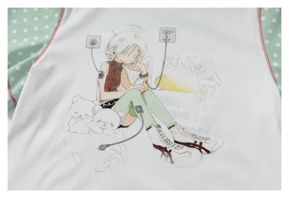 Close-up of the shirt's illustrated angel graphic with English lettering on white fabric.