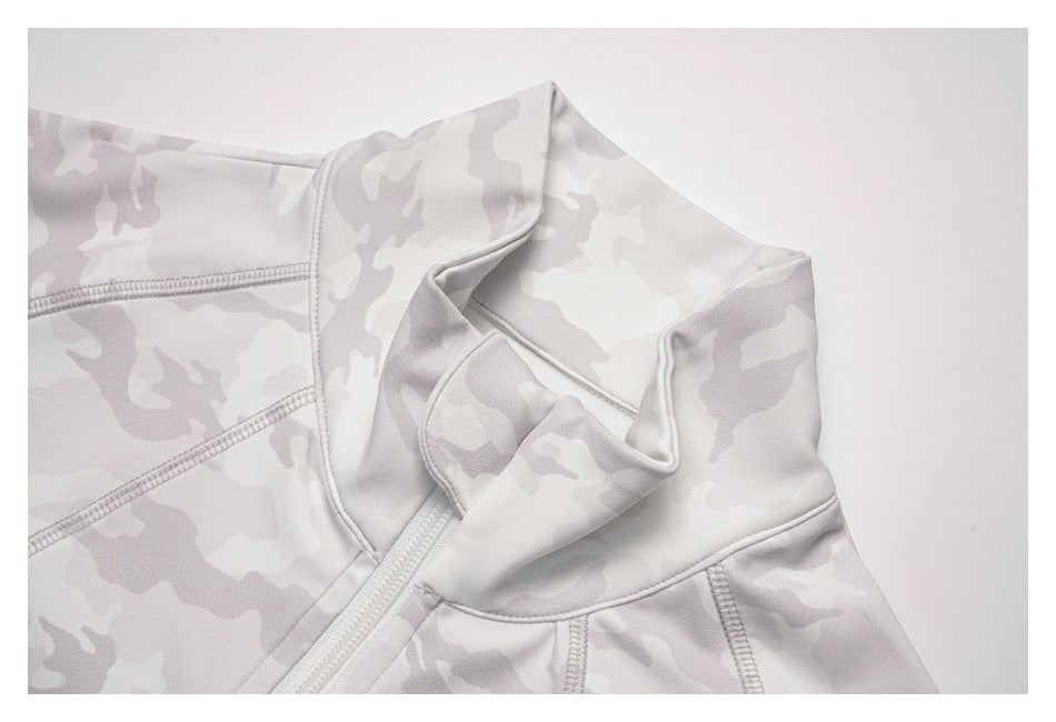 Close-up of the high collar and upper zipper on a light gray camouflage top.
