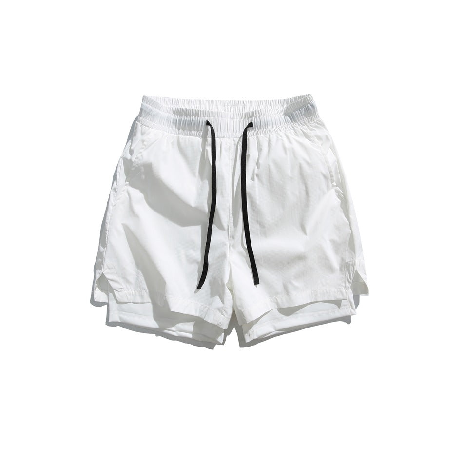White drawstring shorts flat lay, front view, with elastic waistband, side pockets and visible inner layer