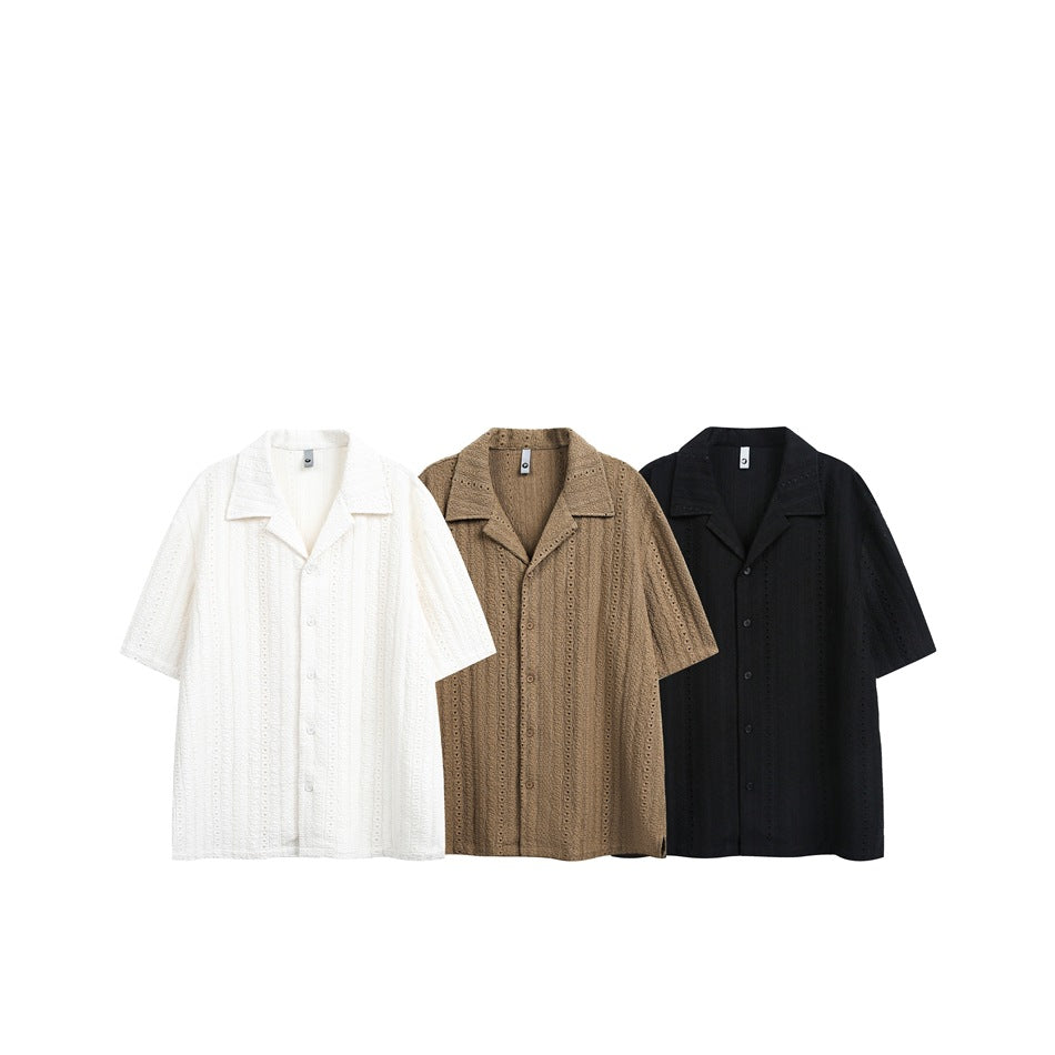 Three short-sleeve eyelet shirts displayed together in white, brown, and black.