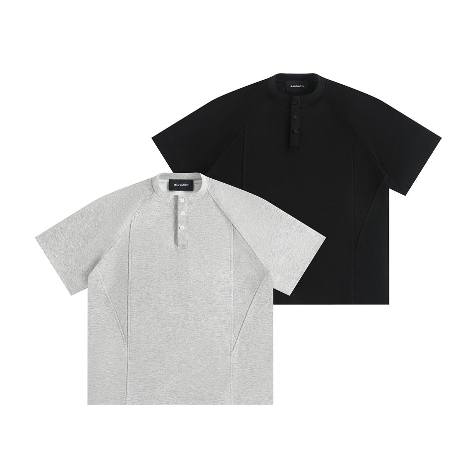 Overlapping front views of short-sleeve henley shirts in heather gray and black, with band collars and button plackets.