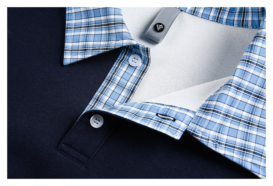 Close-up of the navy polo's blue plaid collar and button placket, shown partly open.