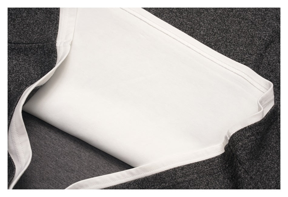 Close-up of the shirt's white inner layer and seams framed by charcoal heather fabric.