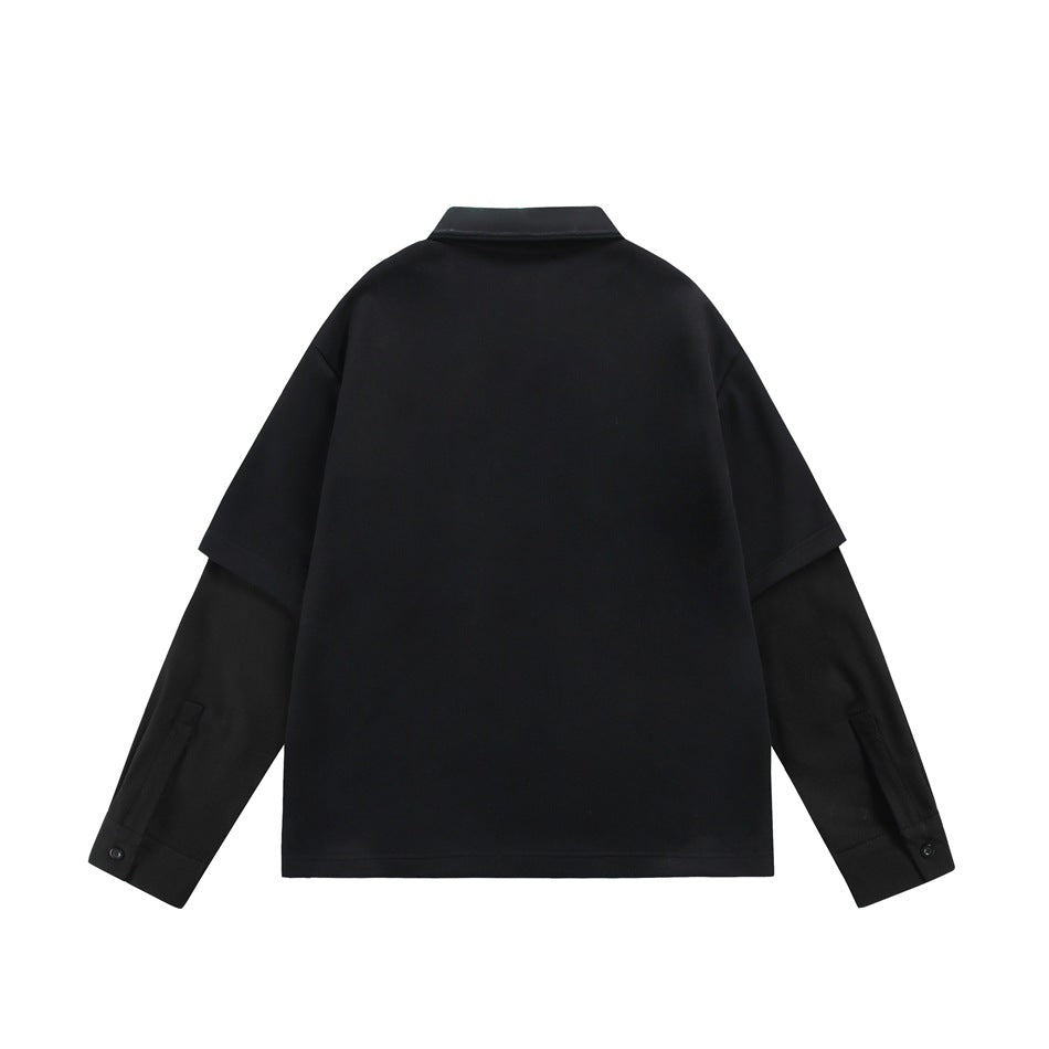 Back view of a black layered shirt with short outer sleeves, long sleeves, and buttoned cuffs.