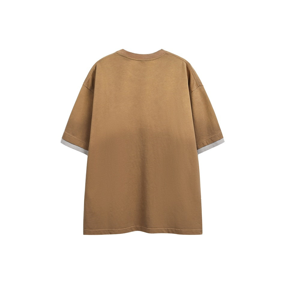 Back view of a relaxed camel-brown short-sleeve T-shirt with a crew neck and contrasting light sleeve edging.