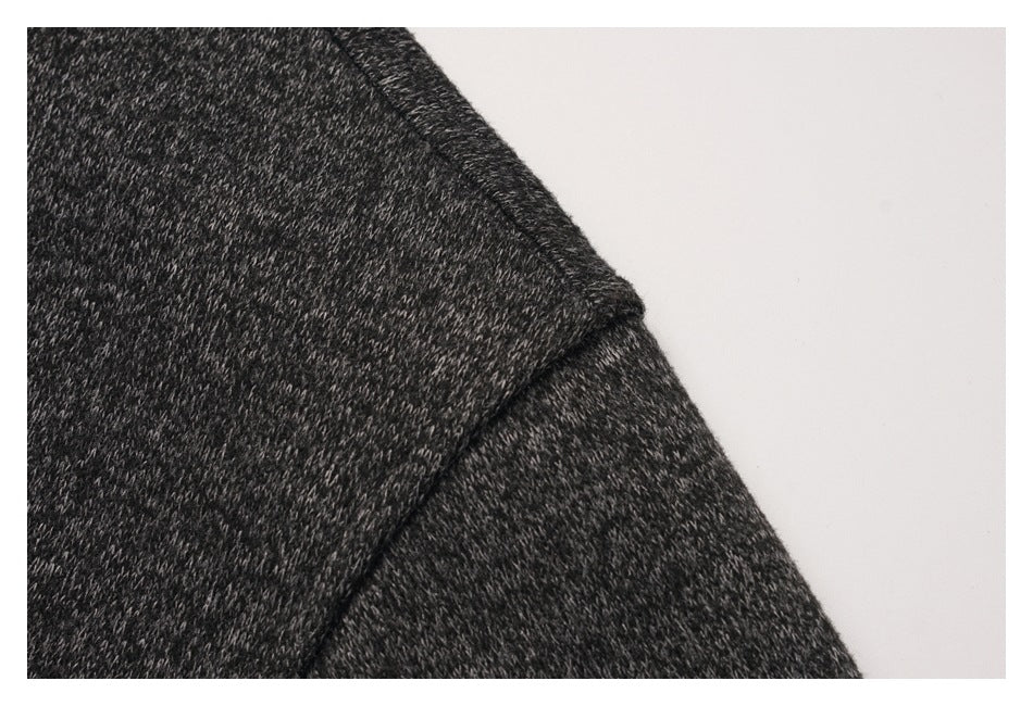 Close-up of a seam on the charcoal heather fabric at the shoulder.