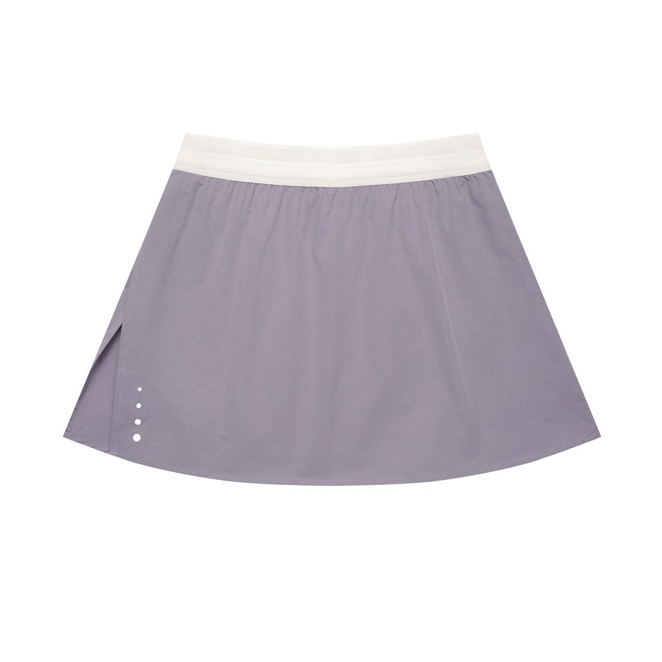 Blue-purple A-line mini skirt with cream elastic waistband, side slit and white dots at the hem, flat lay