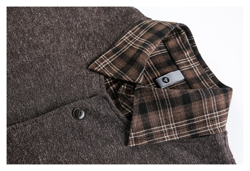 Close-up of a brown plaid collar, dark buttons, and heathered charcoal shirt fabric.