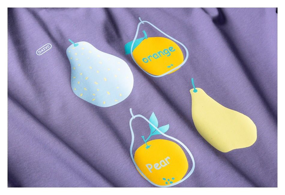 Lavender-purple shirt fabric printed with colorful pear and orange illustrations and English words.