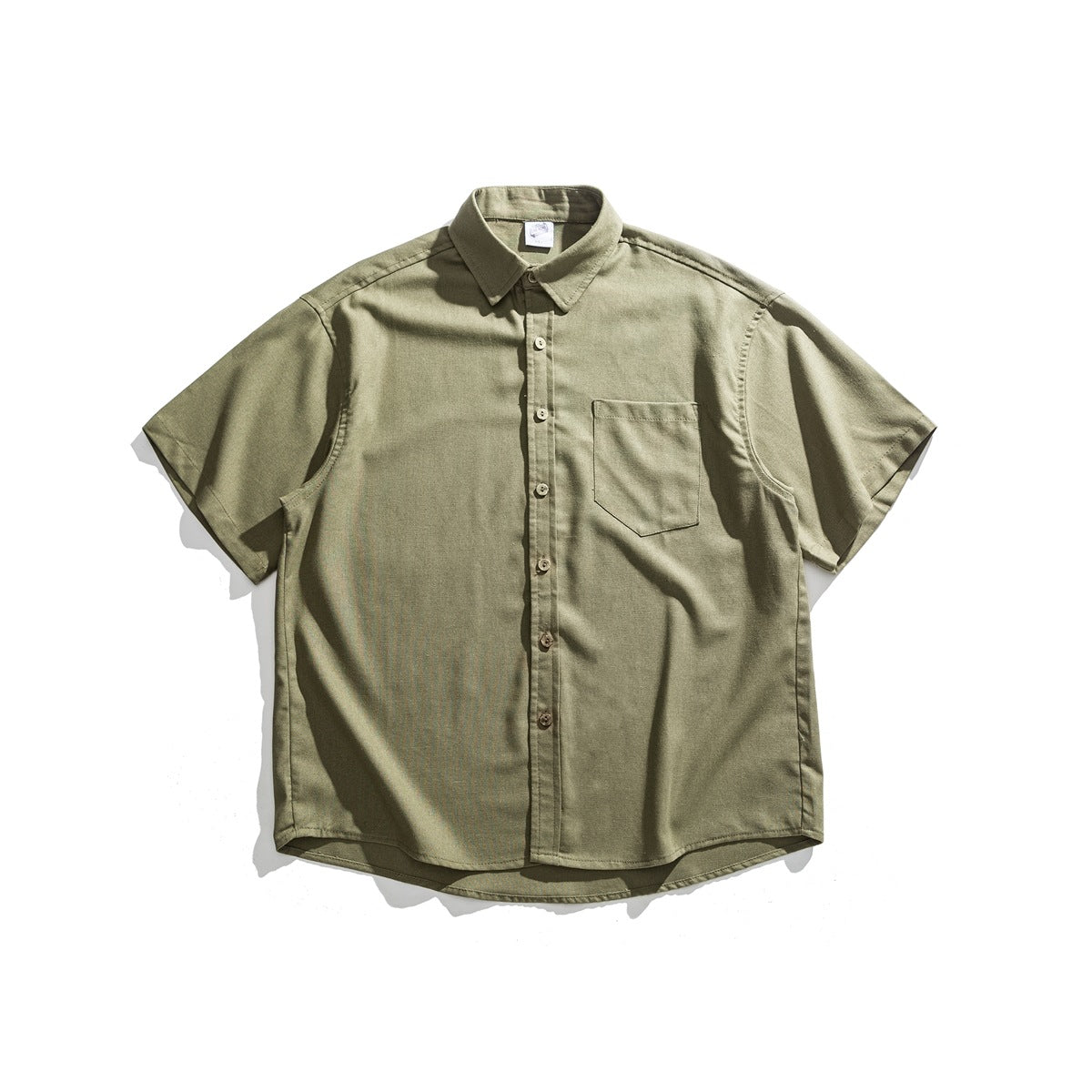 Army green short-sleeve button-up shirt with chest pocket, laid flat on a light background