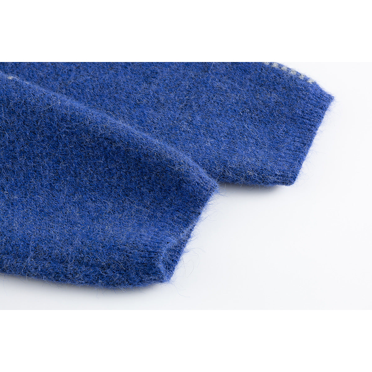 Close-up of the fuzzy blue knit sleeve and ribbed cuff.