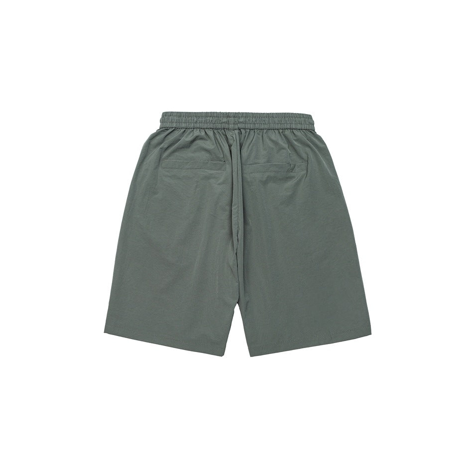 Gray-green shorts back view showing elastic waistband, two back pockets and relaxed leg shape, flat lay