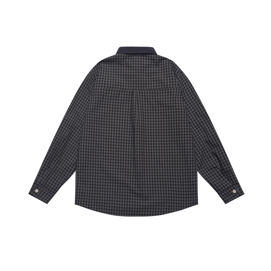 Back view of a dark charcoal plaid long-sleeve shirt with a solid dark collar and buttoned cuffs.