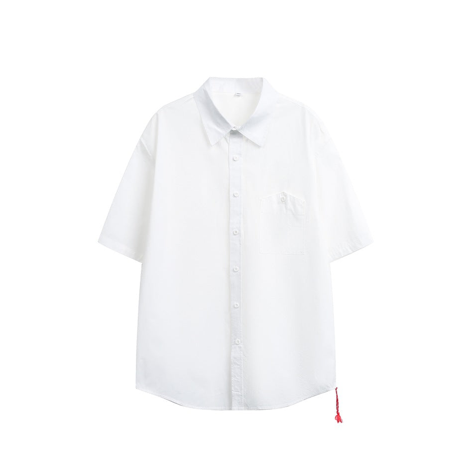 White short-sleeve button-up shirt, front view, with chest pocket and small red tassel at the hem