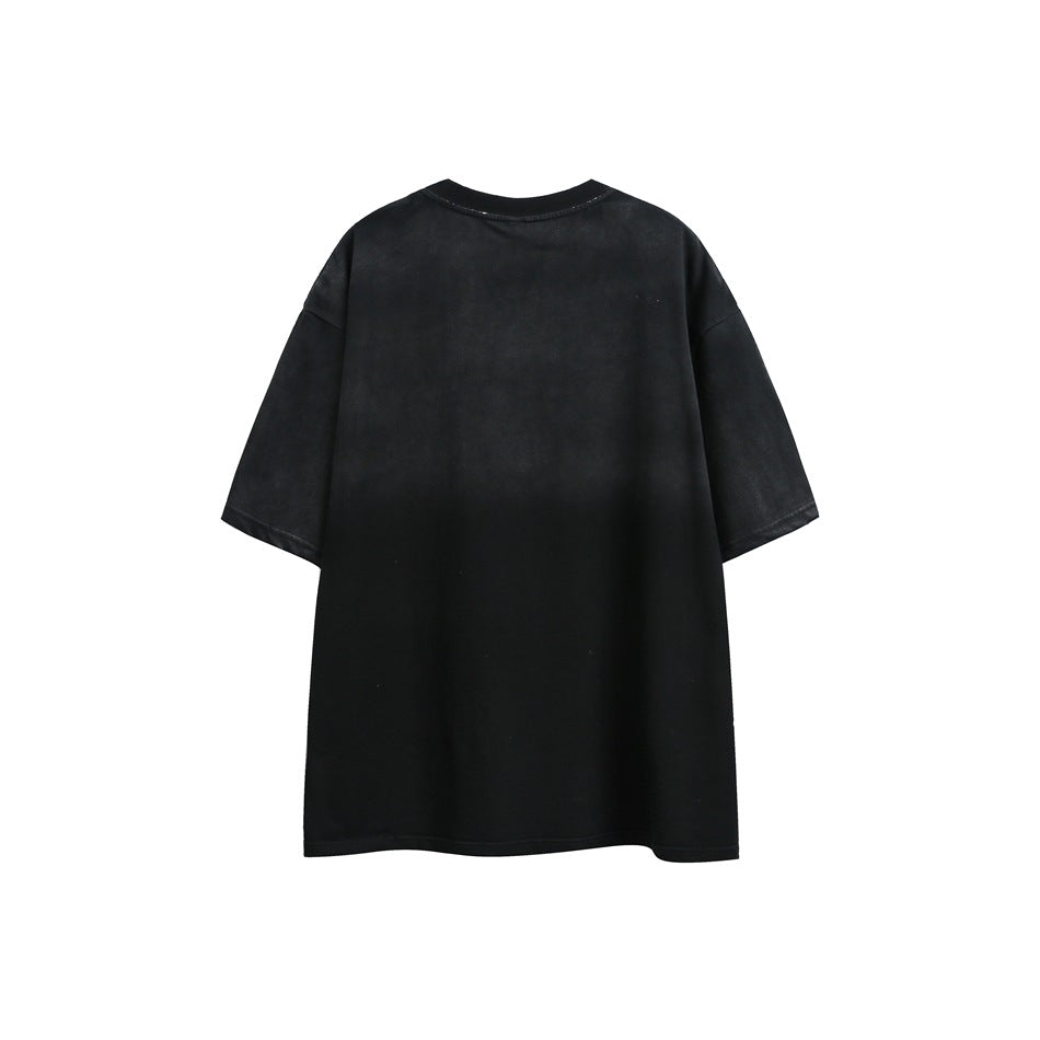 Back view of a plain black oversized T-shirt with short sleeves.