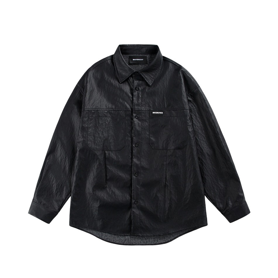 Black glossy faux-leather-look button-up shirt with pointed collar and two chest patch pockets, front view