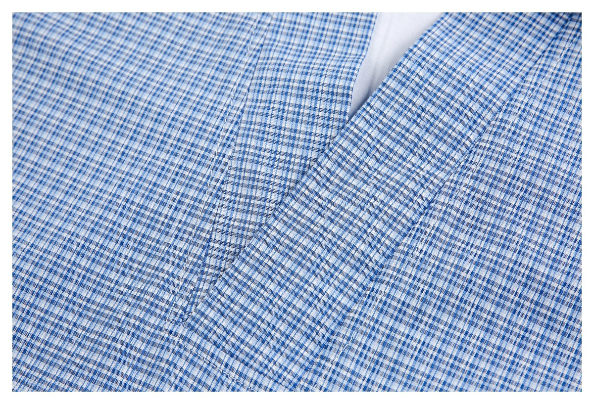 Close-up of the blue-and-white check pattern and stitching along the shirt's front opening.