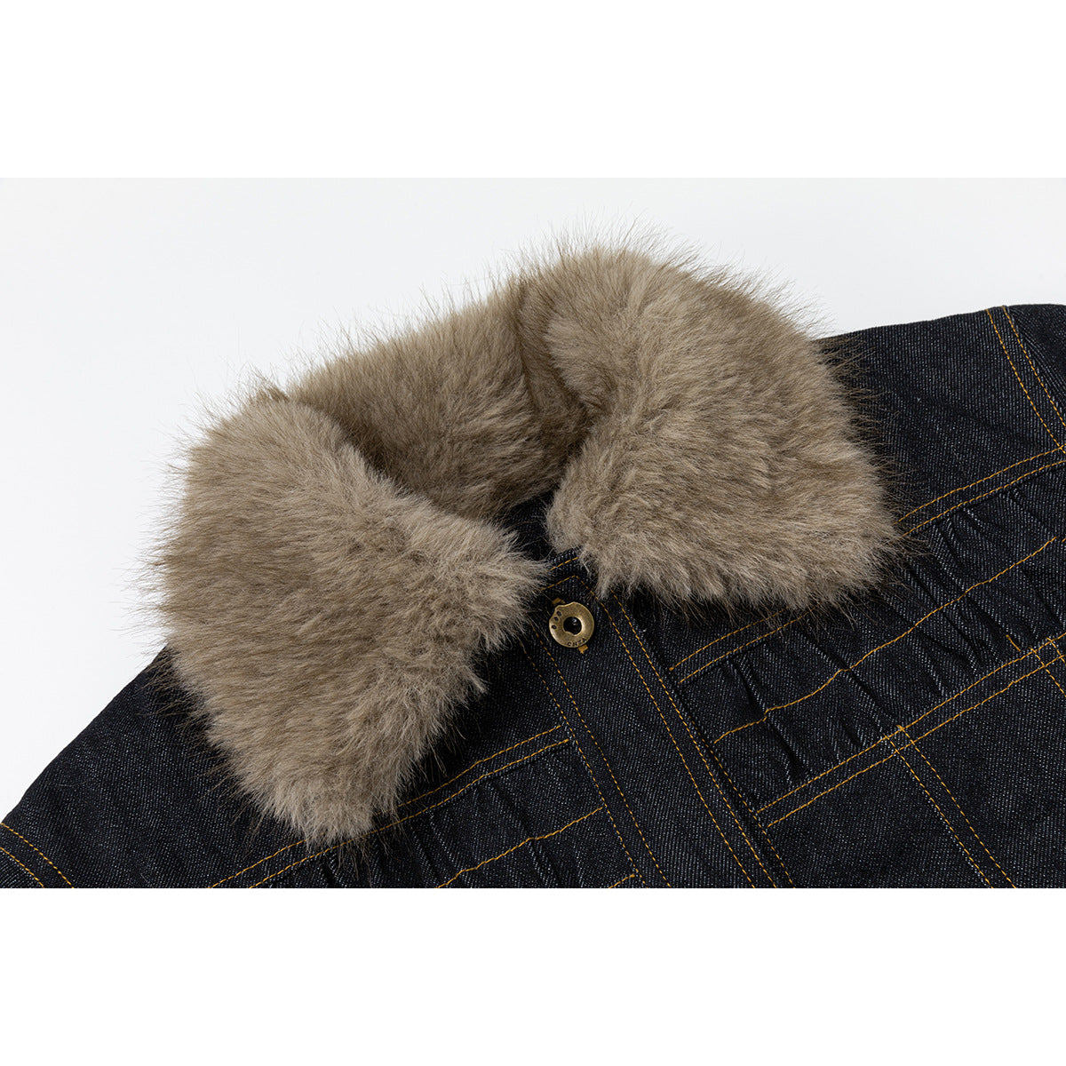 Close-up of the jacket's tan faux-fur collar, gold-tone button and contrast stitching on dark denim.