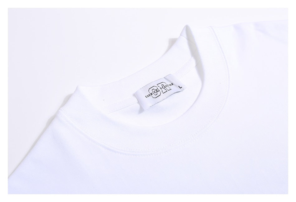 Close-up of a white crew-neck T-shirt collar and interior size label.