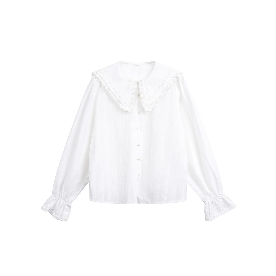 White long-sleeve blouse flat lay with wide lace-trim collar, pearly buttons and ruffled flared cuffs
